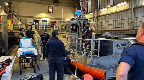 Members of US Coast Guard Station Bellingham and the Bellingham Fire Department prepare to transfer a survivor to emergency medical services personnel in Bellingham, Washington, July 23, 2026. The US Coast Guard, along with the US Navy, the Canadian Coast Guard, and local partner agencies responded to a seaplane emergency landing in Shallow Bay on Washington's Sucia Island earlier that day.