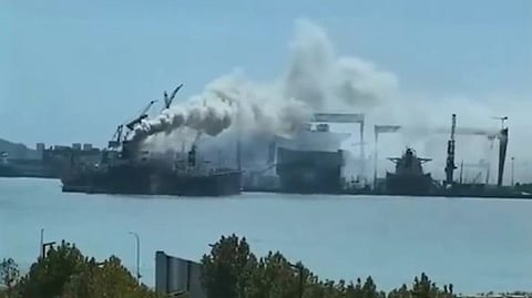 Screenshot of video showing fire aboard a cargo ship undergoing repairs at CSSC's Qingdao Beihai shipyard