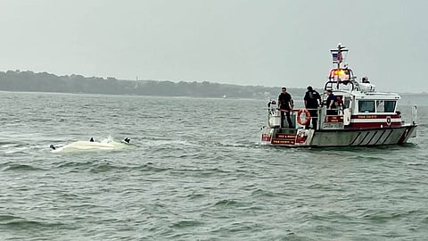 Personnel aboard an Abingdon Volunteer Fire and Rescue response vessel observe the overturned 17-foot boat, September 12, 2026.