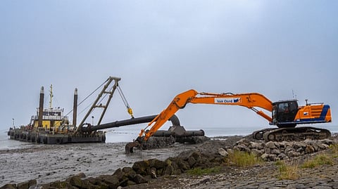 Spray pontoon and excavator working on IJsselmeerdijk reinforcement