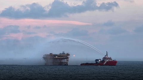 A vessel attempts to extinguish the blaze on the Abkatun-H production platform in the Bay of Campeche off Mexico, October 19, 2026.