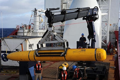 Operators aboard the Royal Australian Navy vessel ADV Ocean Shield move a US Navy Bluefin-21 unmanned underwater vehicle into position for deployment in the Indian Ocean, April 14, 2014, during the search for missing Malaysia Airlines Flight 370. (Photo: US Navy/Petty Officer 1st Class Peter D. Blair)