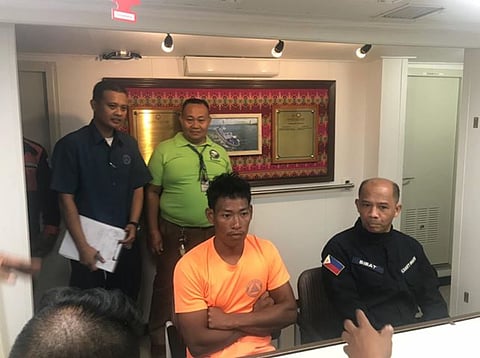 A crewmember of the fishing boat FFB Three Sister being presented by the Philippine Coast Guard to local reporters shortly after his rescue at sea (Photo: Philippine Coast Guard)