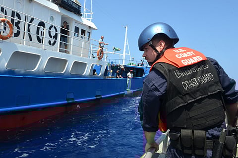 Crewmembers from the US Coast Guard cutter Munro prepare to conduct a law enforcement boarding on a fishing vessel in the Central Pacific, December 2, 2018. (Photo: US Coast Guard)