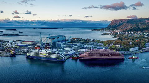 The hull of the expedition ship National Geographic Resolution (right) berthed at the Norwegian yard where it will undergo final outfitting (Photo: Lindblad Expeditions)