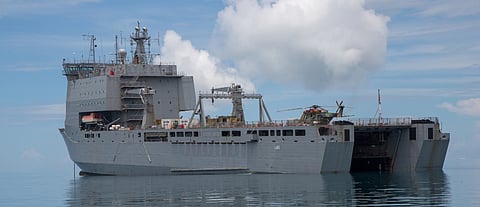 The Royal Australian Navy Bay-class landing ship HMAS Choules at anchor off Tarangau Naval base, Manus Island, Papua New Guinea (Photo: Australian Department of Defence)