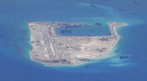 A Chinese-built artificial island with a military-grade runway in Fiery Cross Reef in the South China Sea (Photo: US Navy)