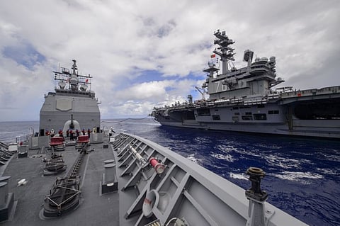 The Ticonderoga-class guided missile cruiser USS Antietam and the Nimitz-class aircraft carrier USS Ronald Reagan conduct underway replenishment in the Philippine Sea on June 21, 2018. (Photo: US Navy/William McCann)