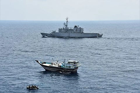 French Navy boarding teams from the frigate Nivôse approach a suspicious dhow leading to the capture of 678 kilograms of methamphetamine and heroin on March 19, 2021. (Photo: French Navy)