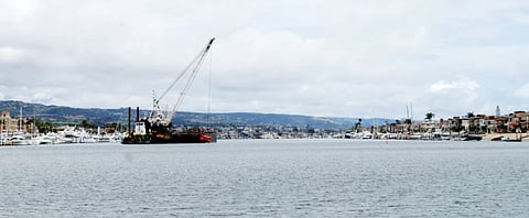 A clamshell dredger in Newport Bay Harbor, California (Photo: USACE)