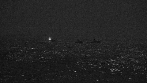 ARABIAN GULF (April 26, 2021) Three Iranian Islamic Revolutionary Guard Corps Navy (IRGCN) fast inshore attack craft (FIAC) approach the US Coast Guard patrol boat USCGC Baranoff and the US Navy patrol coastal ship USS Firebolt while the US vessels were conducting routine maritime security patrols in the international waters of the North Arabian Gulf, April 26, 2021. (Photo: US Navy)