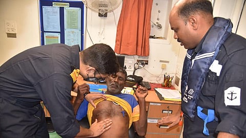 Indian Coast Guard personnel conduct a medical evaluation of one of the rescued crewmen of the fishing vessel Sijumon 1 following a collision with the bulk carrier Navios Venus in the Laccadive Sea on October 22, 2021. (Photo: Indian Coast Guard)