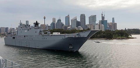 The Royal Australian Navy landing helicopter dock HMAS Adelaide departs Fleet Base East at Garden Island, Sydney, January 17, 2022. Defence is pre-positioning Adelaide to Brisbane to provide additional HADR support if requested by the Government of Tonga. (Photo: Royal Australian Navy/ABIS Susan Mossop)