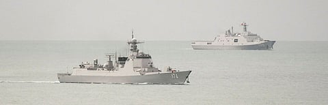 A PLAN Luyang-class guided missile destroyer (left) and a PLAN Yuzhao-class amphibious transport dock vessel leave the Torres Strait and enter the Coral Sea on February 18, 2022. (Photo: Australian Department of Defence)