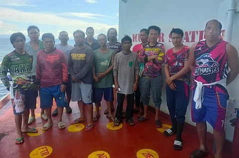 The 13 Filipino crewmen who were rescued following the capsizing of the fishing vessel JOT-18 on May 28, 2022. The capsizing occurred following the collision with the cargo vessel Happy Hiro on the same date. (Photo: Philippine Coast Guard)