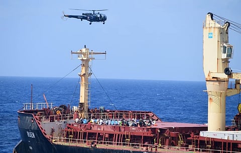 An Indian Navy helicopter hovers near the Malta-flagged bulk carrier Ruen after the pirates that had seized the vessel surrendered following a months-long standoff in the Arabian Sea, March 16, 2024. (Photo: Indian Navy)
