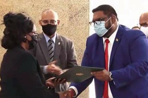 Dr Mohammed Irfaan Ali (right) being sworn in as Guyana's President on August 2, 2020 (Photo: Department of Public Information, Government of Guyana)