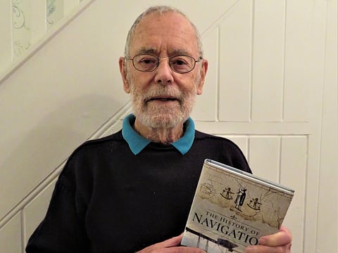 Renowned maritime author Dag Pike with a copy of his book The History of Navigation (Photo: Pen and Sword Books official Facebook page)