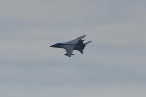 A Chinese People's Liberation Army JH-7 jet fighter-bomber making a low-level pass near the Royal Netherlands Navy frigate HNLMS Tromp in the East China Sea, date unknown (Photo: Dutch Ministry of Defence)