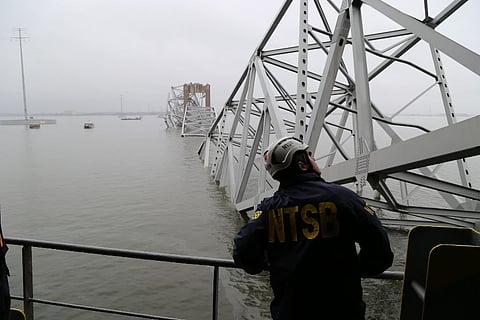 A National Transportation Safety Board inspector surveys the damaged Francis Scott Key Bridge in Baltimore after it was struck by the containership Dali on March 26, 2024. The incident left at least ix people dead. (Photo: National Transportation Safety Board)