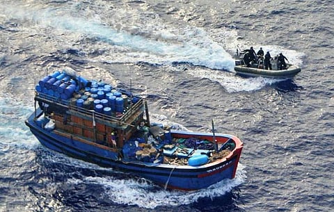 Australian Maritime Border Command personnel on a high-speed boat interdict an Indonesian vessel suspected of illegal fishing in the Australian Fishing Zone, October 7, 2017. (Photo: Australian Fisheries Management Authority)