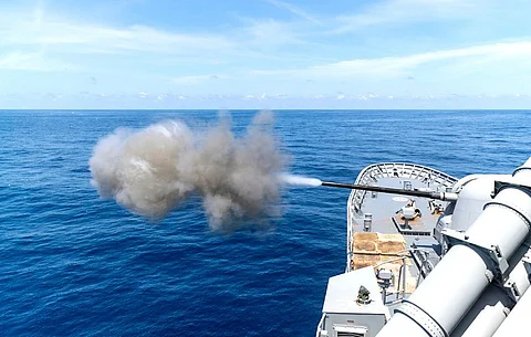 The Anzac-class frigate HMAS Perth fires its main gun during anti-aircraft firing serials in the Northern Australian Exercise Area off the coast of Darwin for Exercise KAKADU 2022, September 17, 2022. (Photo: Australian Department of Defence/LSIS Jarryd Capper)