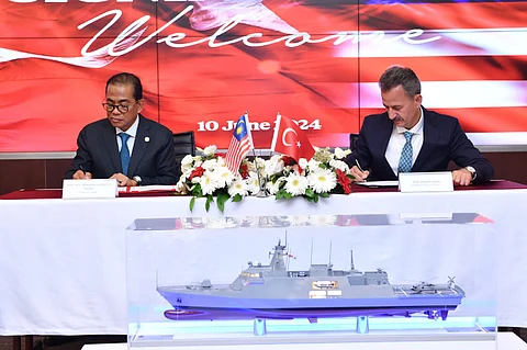 Malaysian Defence Minister Mohamed Khaled Nordin and Turkish Defence Industry Agency President Haluk Görgün sign the memorandum of understanding for the construction of three new littoral mission ships for the Royal Malaysian Navy in a ceremony on June 10, 2024. (Photo: STM Defence)