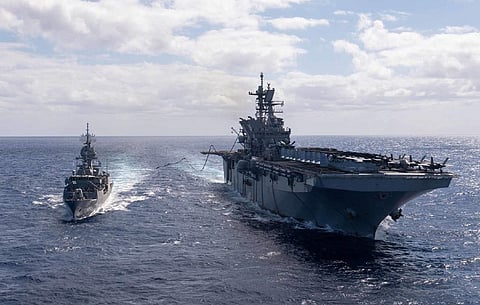 The US Navy amphibious assault ship USS America conducts a fuelling-at-sea with the Royal Australian Navy frigate HMAS Ballarat in the Coral Sea on July 27, 2021, during Exercise Talisman Sabre 21. (Photo: US Navy/Mass Communication Specialist 3rd Class Matthew Cavenaile)
