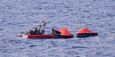 A US Coast Guard small boat crew from cutter USSGC Resolute recovers two life rafts from the sunken schooner De Gallant north of Great Inagua, May 21, 2024. (Photo: US Coast Guard)