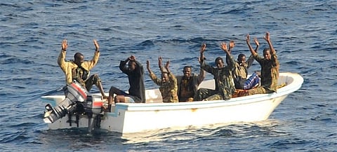 Suspected pirates await boarding of their vessel by US Navy personnel somewhere in the Gulf of Guinea. (Photo: US Navy/Jason R. Zalasky)