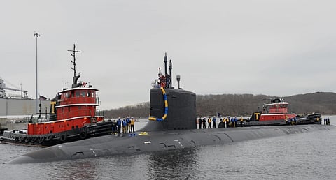 Sailors assigned to the nuclear-powered attack submarine USS Virginia stand topside as their friends and families cheer their arrival at Naval Submarine Base New London in Groton, Connecticut, on February 22, 2018. (Photo: US Navy/Mass Communication Specialist 1st Class Steven Hoskins)