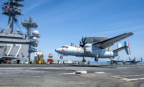 An E-2C Hawkeye attached to squadron 4F of the French navy lands during flight operations on the flight deck aboard the aircraft carrier USS George HW Bush 329ab847f562aaa0a479924ce0a8c79f