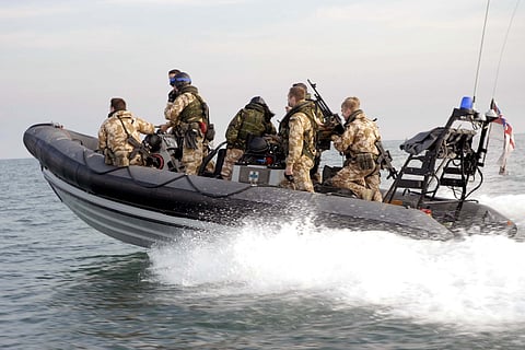 Royal Marines enjoy an early morning run to Iraq’s Khawr al Amaya Oil Terminal (KAAOT) on a Royal Navy RHIB from HMS Campbelltown. Photo: DoD