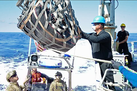 Three bales of cocaine are transferred from HMCS Whitehorse to a rigid-hulled inflatable boat from the USCG cutter Steadfast on April 8. Image: MARPAC Public Affairs