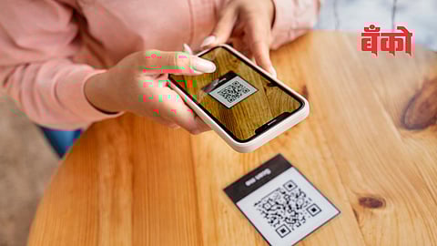 smartphone in hand with QR code