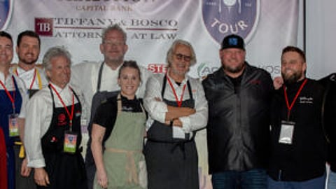 Celebrities and volunteers pause for a photo at the "Taste Fore the Tour" event conducted in 2024 with the WM Phoenix Open PGA event. Tradition Capital Bank helped bring the event to Phoenix from the Twin Cities. The recently-held 2025 event raised money for the Boys and Girls Club of Arizona. 