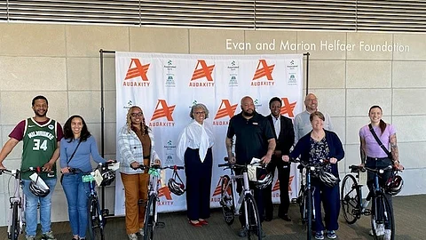 Associated Bank leadership with bike recipients. 