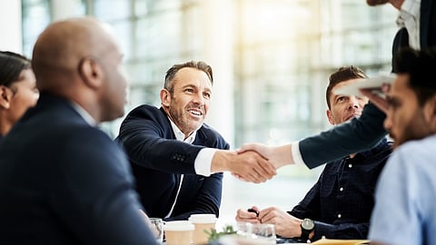 Office handshake photo BankNews.com