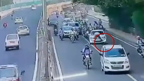 Delhi traffic policeman being dragged on bonnet of a car- Image for representational purpose