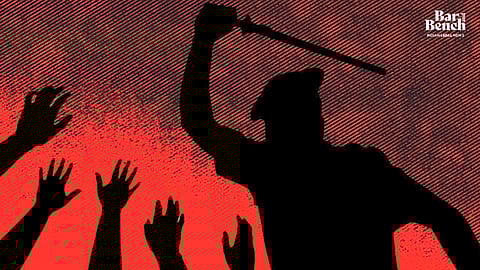 Police with lathi raised