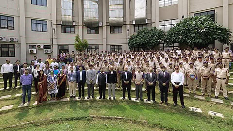 Police officers and faculty of HNLU with dignitaries who attended the conclave