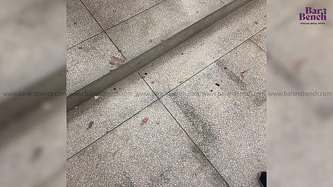 Blood droplets at the Jammu court following the assault incident
