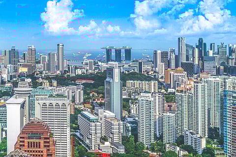 Photo of Singapore, with Marina Bay Sands and vessels in background