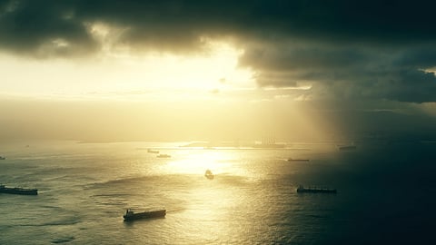 Photo of vessels at stormy sunset