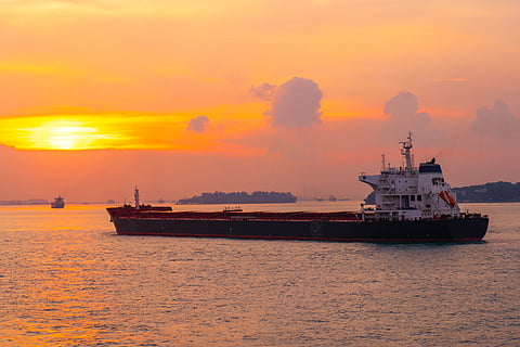Photo of vessel in waters near Singapore at sunset