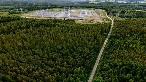 A utility-scale standalone battery energy storage facility in Teuva, Finland, featuring rows of containerized BESS units, electrical equipment and grid infrastructure in a Nordic landscape.