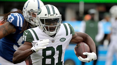 File-This Oct. 14, 2018, file photo shows New York Jets wide receiver Quincy Enunwa (81) running with the ball against the Indianapolis Colts during the first half of an NFL football game, in East Rutherford, N.J. The Jets have signed Enunwa to a contract extension, keeping one of their key offensive players who was scheduled to be a free agent in the offseason. The team announced the multiyear deal Friday, Dec. 28, 2018, after its final full practice of the regular season. A person familiar with the contract tells The Associated Press the deal is worth $36 million over four years, including $20 million in guarantees. (AP Photo/Seth Wenig, File)