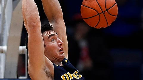 Drexel’s James Butler dunks against Connecticut in December