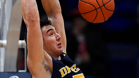 Drexel’s James Butler dunks the ball during the first half of an NCAA college basketball game against Connecticut, Tuesday, Dec. 18, 2018, in Hartford, Conn. (AP Photo/Jessica Hill)