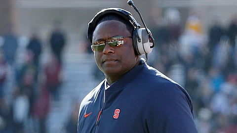 FILE- In this Nov. 24, 2018 file photo, Syracuse head coach Dino Babers looks on during the first half of an NCAA college football game against Boston College, Saturday in Boston. Babers has transformed Syracuse into a winner in three years at the helm. The Orange, who have won nine games and are ranked No. 17, meet No. 15 West Virginia on Friday, Dec. 28, 2018 in the Camping World Bowl. Babers, who just inked a contract extension, feels this is the start of sustained success that could lead to greater heights. (AP Photo/Mary Schwalm, File)
